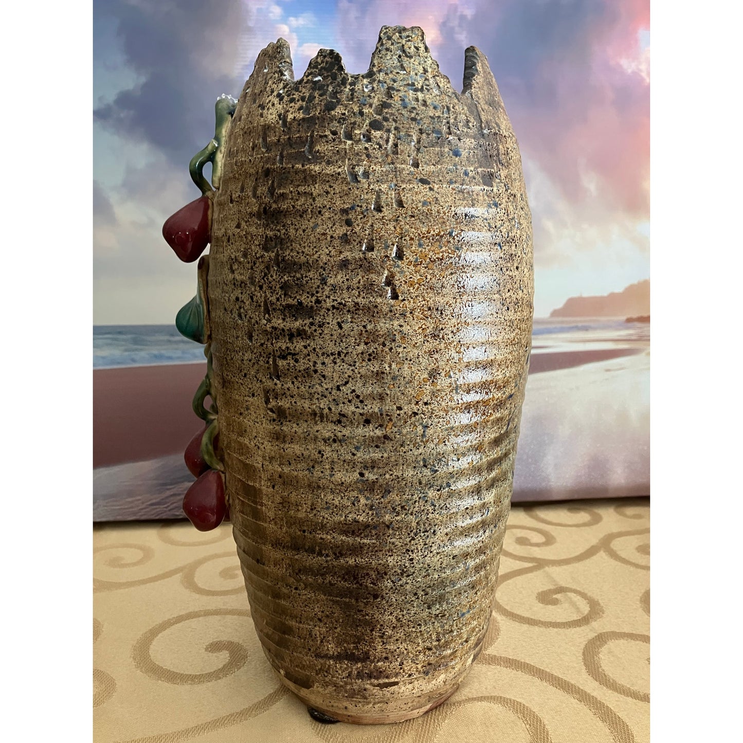 Shiwan pottery vase adorned with deep red cherry and green vines