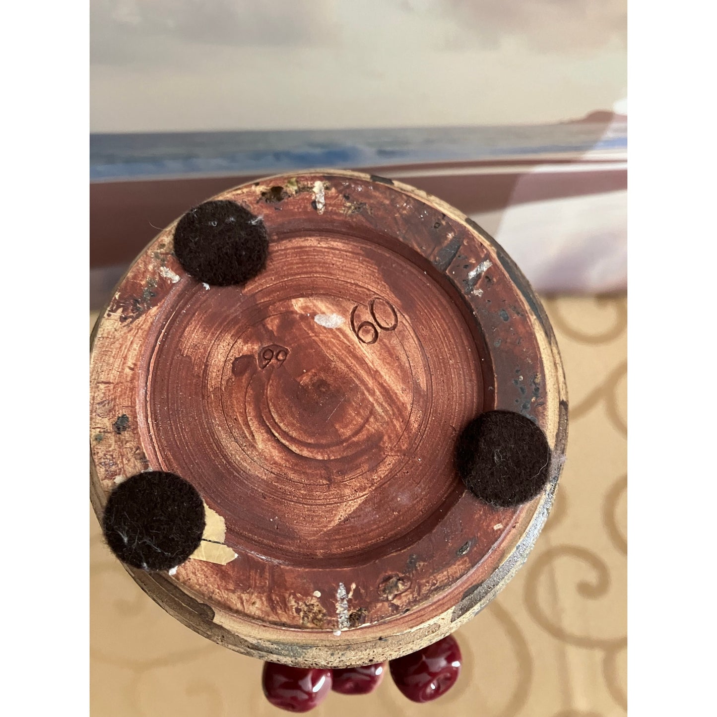 Shiwan pottery vase adorned with deep red cherry and green vines